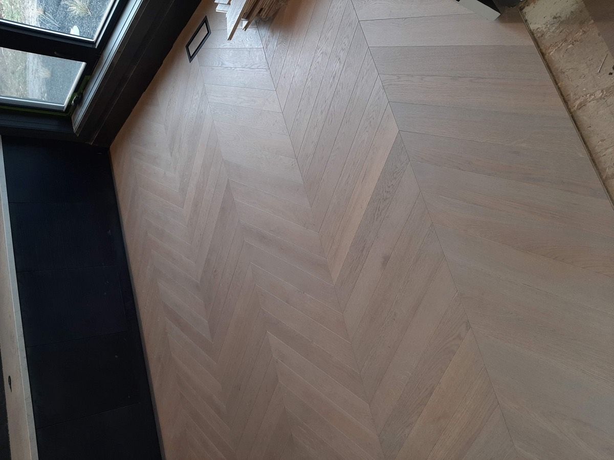 Elegant chevron hardwood installation