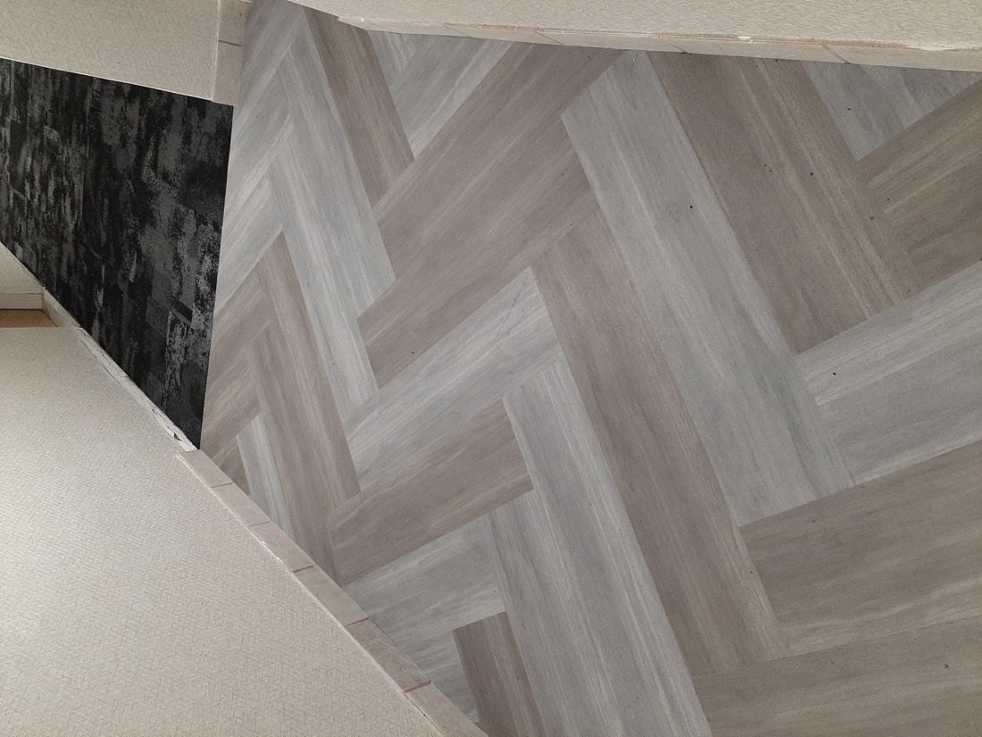 Luxury vinyl plank meeting commercial carpet tile